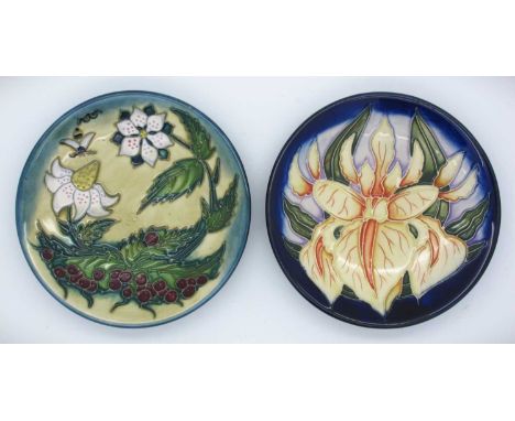 Two Moorcroft Pin Trays, 'Windrush' by Debbie Hancock dated 2000 and 'Fruit Garden' date cypher for 2001, both 12cm diameter.
