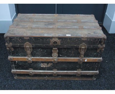 Metal Ravel Trunk, with woodworm to horizontal protection slats, fitted interior, 94cm wide.