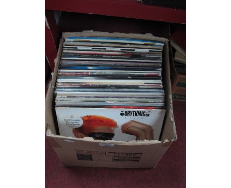 An assortment of LP records to include various from Elvis, Madonna, John Lennon, Paul Young, Michael Jackson and ABBA, approx