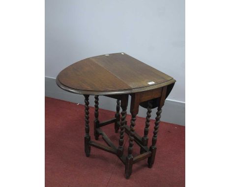 1930's Oak Gate Leg Table, with drop leaves on barley twist and block supports.