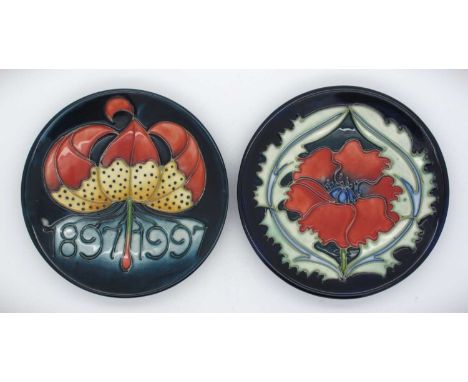 Two Moorcroft Pin Dishes, 'Centenary 1897-1997 dated 97 and 'Moorcroft Poppy' dated 96, both 12cm diameter. (2)Centenary plat