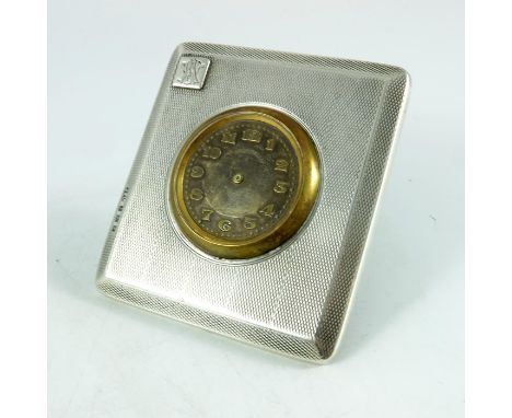 An Art Deco silver desk timepiece, A Buckley Ltd., Birmingham 1923, bevelled rectangular form, engine turned barley stripes w