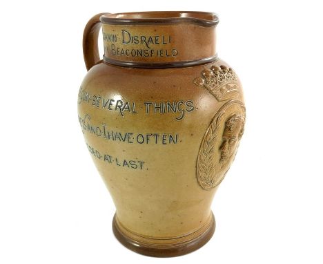 A Doulton Lambeth commemorative stoneware jug, Benjamin Disraeli, circa 1881, shouldered form, incised with mottos and applie