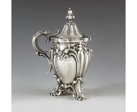 Henry Wilkinson and Co., Sheffield 1848, a Victorian silver mustard pot, heavily embossed fluted ogee pear or bombe form on t