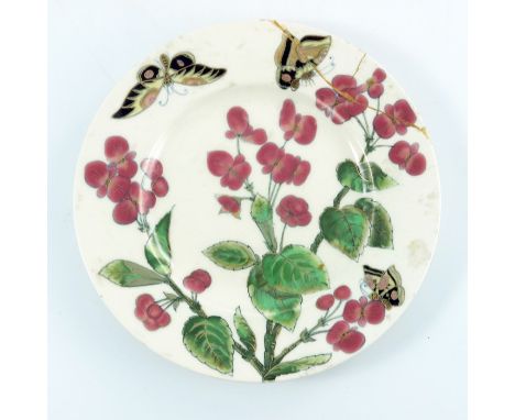 A Zsolnay Pecs, a painted plate, circa 1878, decorated with flowers and butterflies, 21.5cm diameter