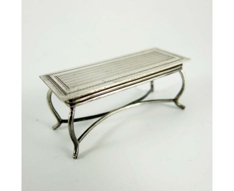 An Elizabeth II silver miniature novelty coffee table, Hampton Utilities, Birmingham 1964, engine turned rectangular top on c