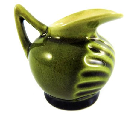 Christopher Dresser for Linthorpe, an art pottery miniature jug, model 1494, circa 1885, green majolica glazed ovoid form, re