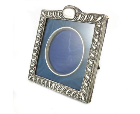 A Victorian silver photo frame, Henry Matthews, Birmingham 1900, square form, gadrooned and glazed with removable inner ring,