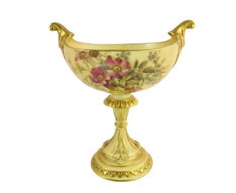 A Royal Worcester blush ivory oval pedestal vase, the oval boat shape body raised on a fluted, gilt highlighted flared base m