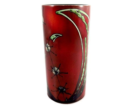 A Poole cylindrical vase, circa 1980, seed pod and leaf design, raised marks, 21cm high