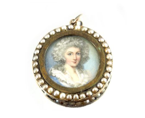 A yellow metal and seed pearl pendant with portrait miniature, 3.5cm diameter
