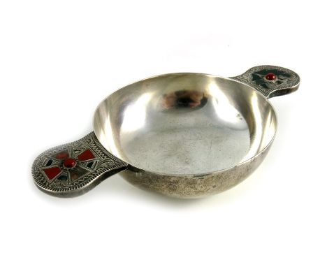 An Arts and Crafts, Scottish hardstone mounted silver quaich, James Fenton, Birmingham 1910, conventional twin handled form, 