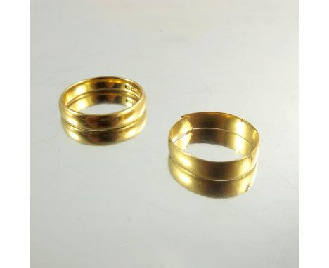 Two 22ct yellow gold wedding bands, 7.0g, stamped 22ct, Birmingham, one ring split (2)
