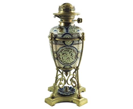 Mark V Marshall for Doulton Lambeth, a stoneware and brass oil lamp, 1882, egg form, carved, incised and slip decorated with 