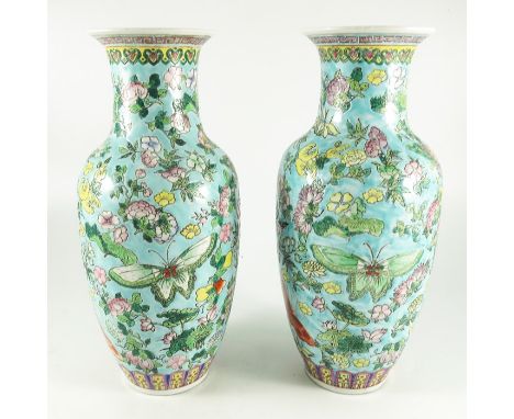 A pair of Chinese porcelain vases, Jiaqing seal mark, famille rose decorated with butterfly and floral design, between bands 