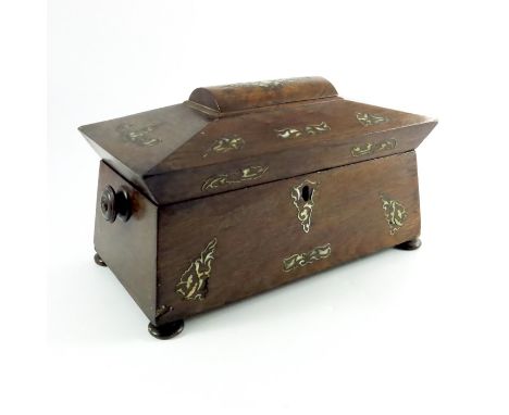 A William IV rosewood and mother of pearl inlaid tea caddy, sarcophagus form, with knop handles, decorated with foliate shell