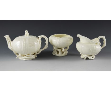 A Belleek Echinus three piece tea set, including teapot, jug and bowl, relief moulded as sea urchins and coral, black marks, 