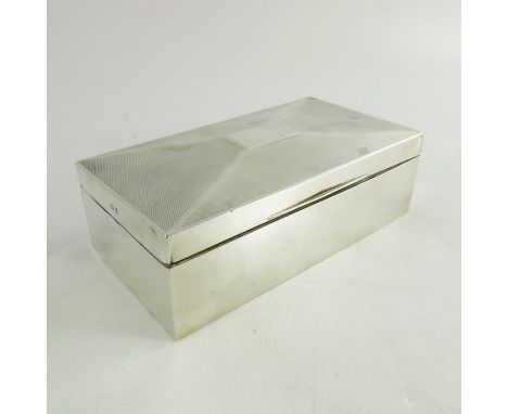An Art Deco silver cigar box, Barker Brothers Silver, Birmingham 1936, shallow pitched lid, engine turned, cedar lined, 17cm 