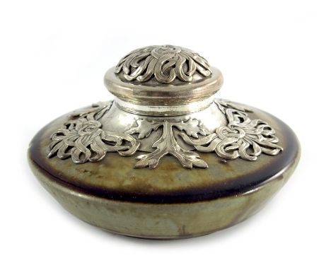 Alexandre Bigot, a French Art Nouveau art pottery and silver plated inkwell, circa 1900, squat circular form, applied with ca