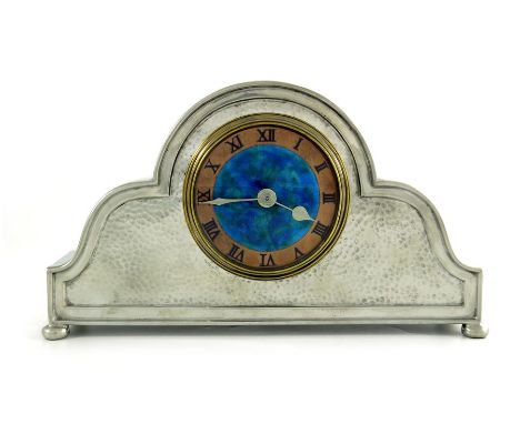Liberty and Co., a Tudric pewter and enamelled mantle clock, model 01492, the 3.5 inch copper ringed dial with blue green ena