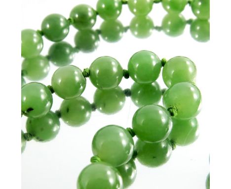 A Chinese jade and 10 carat gold necklace, 65cm long