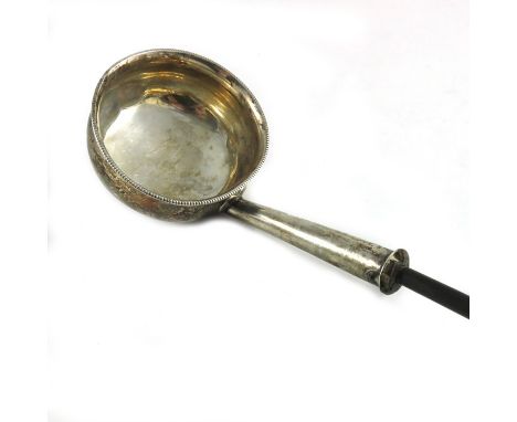 A George III Scottish Provinical silver toddy or punch ladle, Dumfries, circa 1810, ogee ovoid form with milled rim and twist