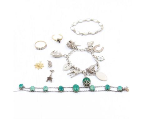 Two 9ct gold stone set rings, silver charm bracelet, two other bracelets and loose charmsCondition Report:9ct approx 3.61 gra