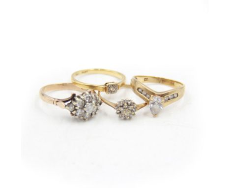 Four 9ct gold stone set rings, to include a diamond flower cluster ring, cubic zirconia wishbone ring and two others, all sta