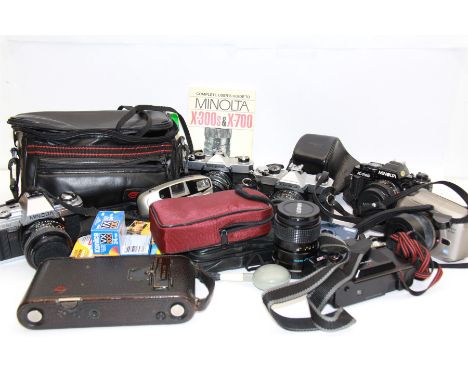 Collection of cameras, including Minolta, Fujica, and Kodak examples and accessories