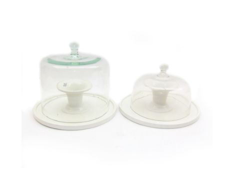 Two French glass cloches, with footed ceramic bases marked 'Geo.S.Elliott & Son Ltd