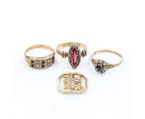 Three Victorian 9ct gold stone set rings, to include navette shaped paste ring and two split pearl and red stone set rings, a