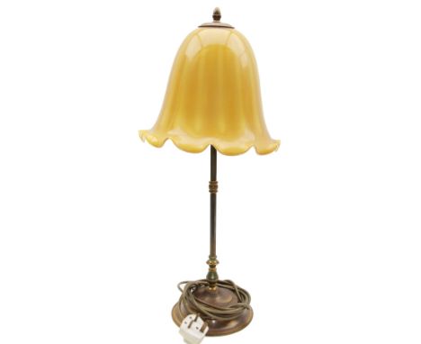 Brass table lamp, with knopped stem upon a stepped circular foot, with opaque yellow/orange fluted glass shade, including sha
