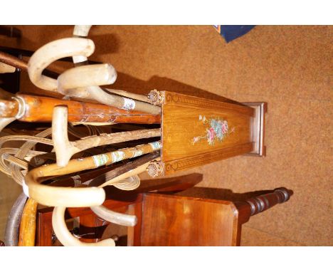 Large collection of walking sticks in a Edwardian stick stamd