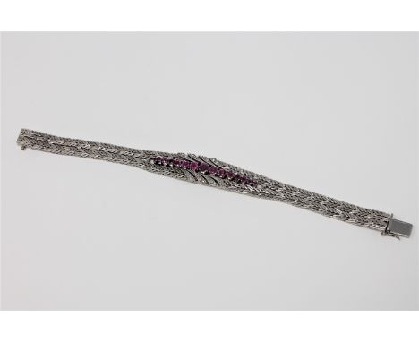 A fine quality ruby and diamond bracelet in 18ct white gold, 52g.