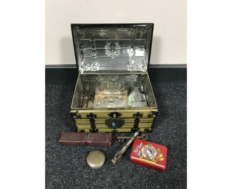 A GBC biscuit tin in the form of a trunk containing interesting collectables - Parker pen, inkwell, Durham duplex razor, keys