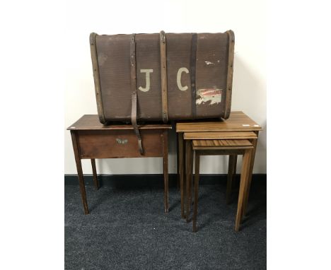 A nest of three mid-20th century teak tables together with a sewing box and a wooden bound trunk