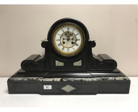 A Victorian slate mantle clock with gilt and enamel dial