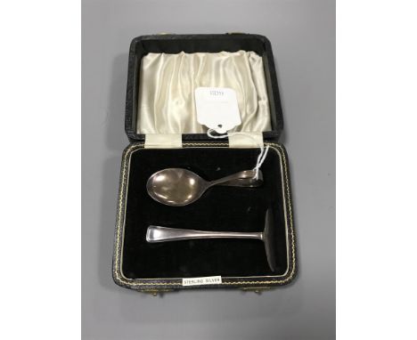 A Sterling silver cased baby spoon and pusher