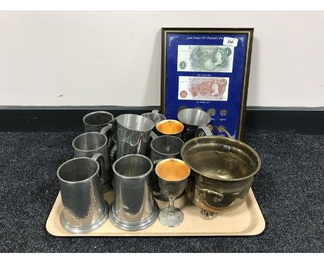 A tray of assorted metal ware, goblets, tankards, planter, decimal coins and notes 