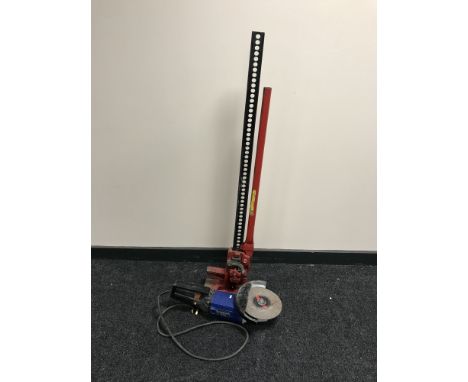 A Clark Strongarm Farm Jack (48 inches) together with an angle grinder 