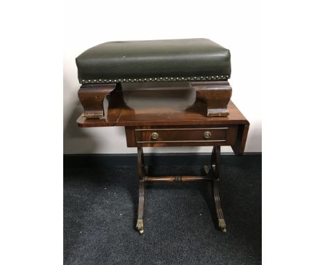 A mahogany sofa table together with a leather upholstered footstool