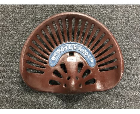 A cast metal tractor seat  - W M Doyle and Company ltd 