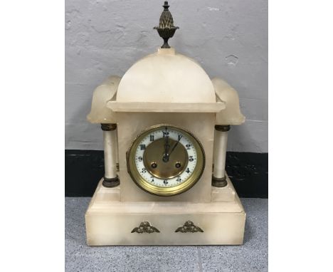 A French opaque marble mantle clock with brass and enamel dial