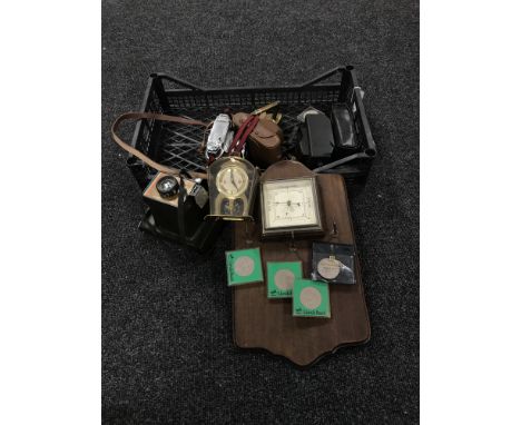 A basket of assorted cameras, oak barometer, brass flat iron, crowns etc 