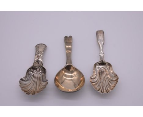 A George IV&nbsp;silver shell caddy spoon, by Taylor &amp; Perry,&nbsp;Birmingham 1830; together with two others, 25.5g. (3) 