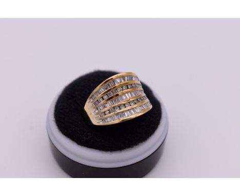 A baguette and brilliant cut diamond set gold ring, hallmarked 9ct ring,&nbsp;1ct approximately, 4.6g total weight. 