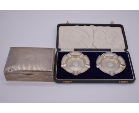 A cased pair of silver ashtrays, by&nbsp;Walker &amp; Hall,&nbsp;Birmingham 1934, 58g; together with a silver engine turned c