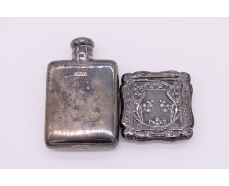 A small silver hip flask, retailed by&nbsp;Finnigan's,&nbsp;London 1912, 8cm high; together with a small silver pill box, by 