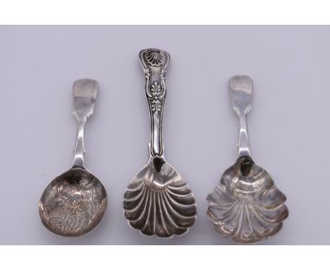 A William IV silver shell, fiddle &amp; thread pattern caddy spoon, makers mark indistinct,&nbsp;London 1834; together with t