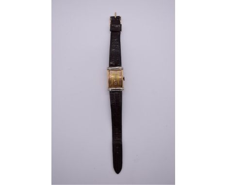 A vintage Art Deco style Bulova 14k gold filled manual wind tank watch,&nbsp;21 x 33mm,&nbsp;ref. 8AE, on leather strap. 